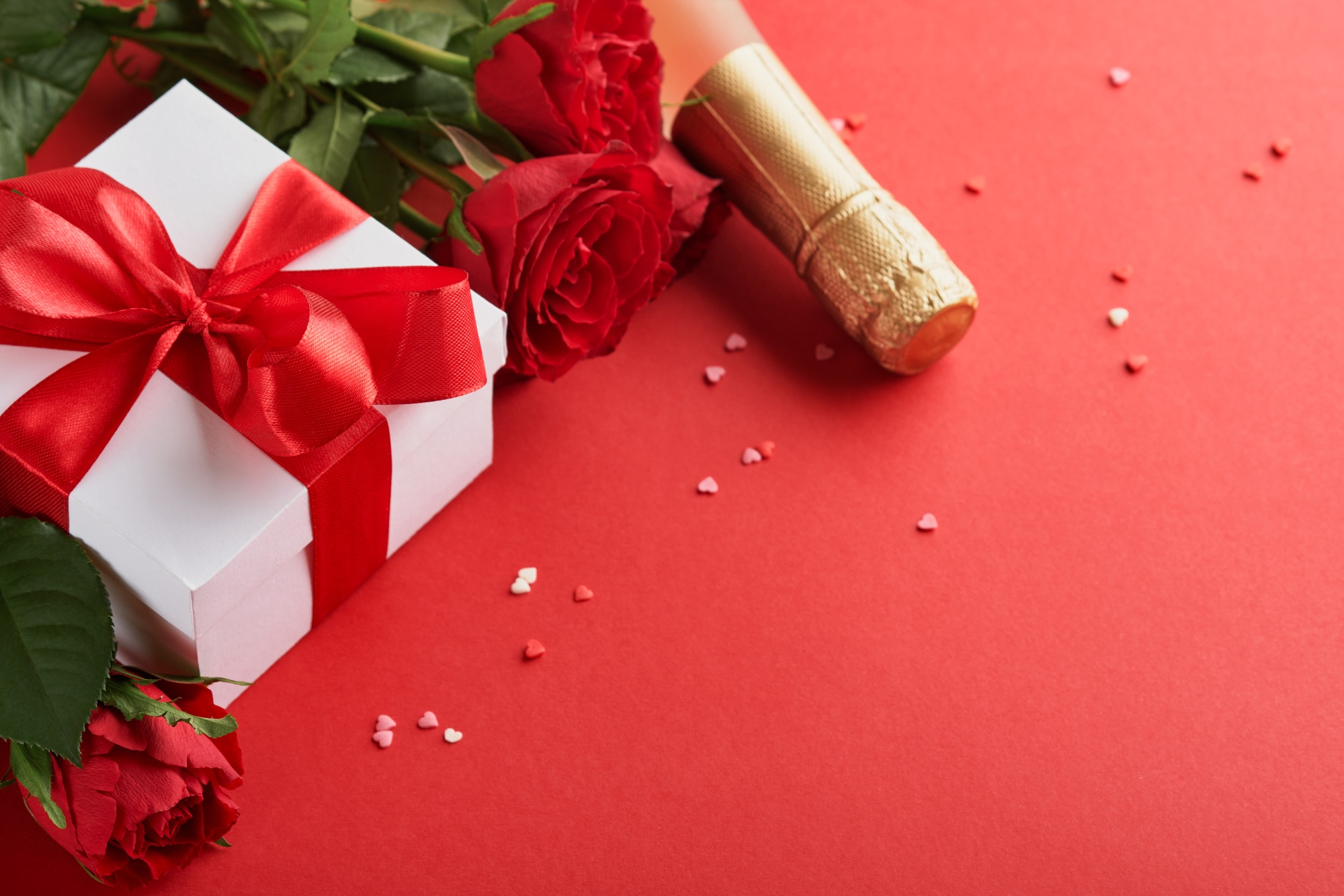 Valentines Day or Romantic dinner concept. Romantic table setting, silverware, wine glasses, gift bo