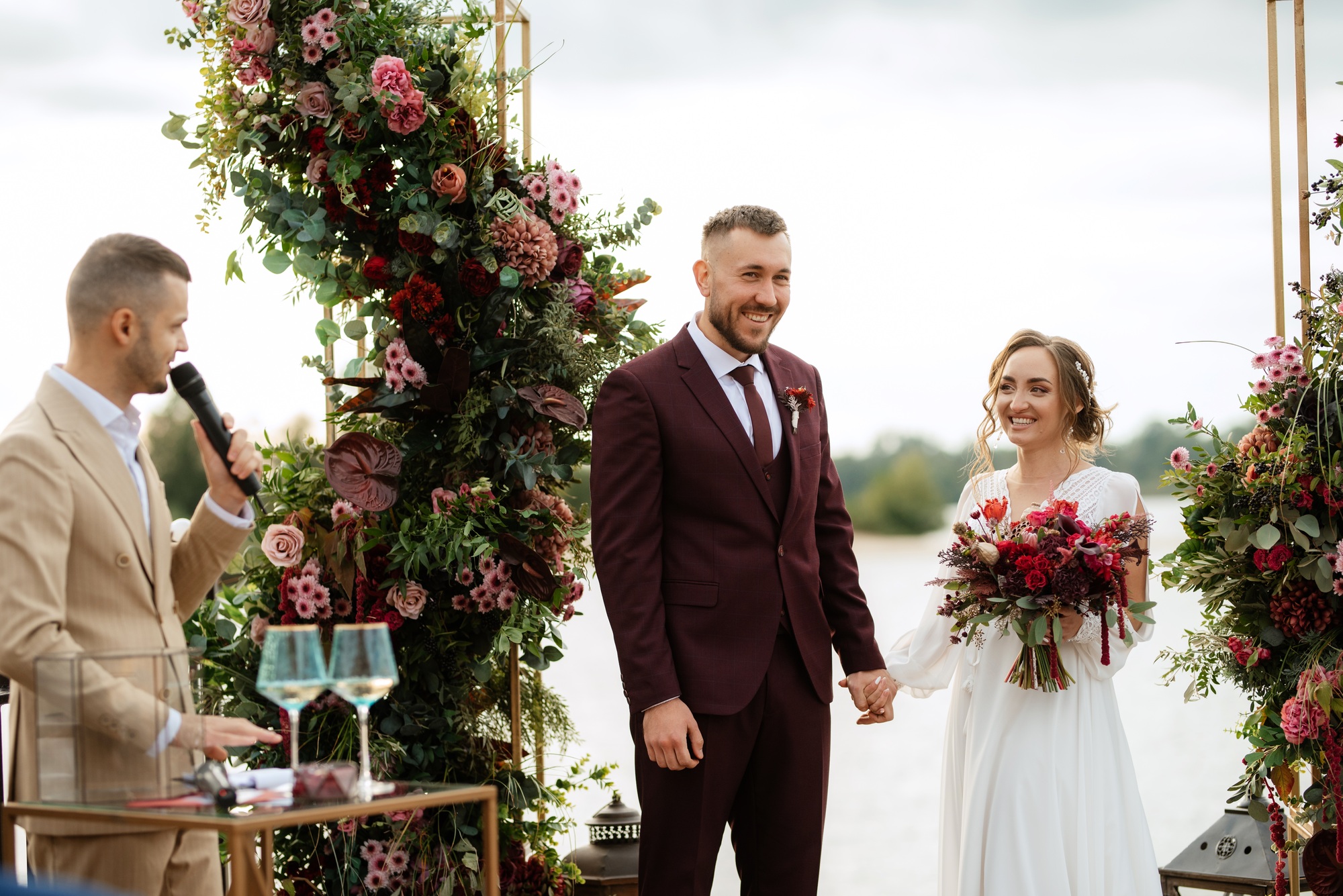 wedding ceremony of the newlyweds on the pier